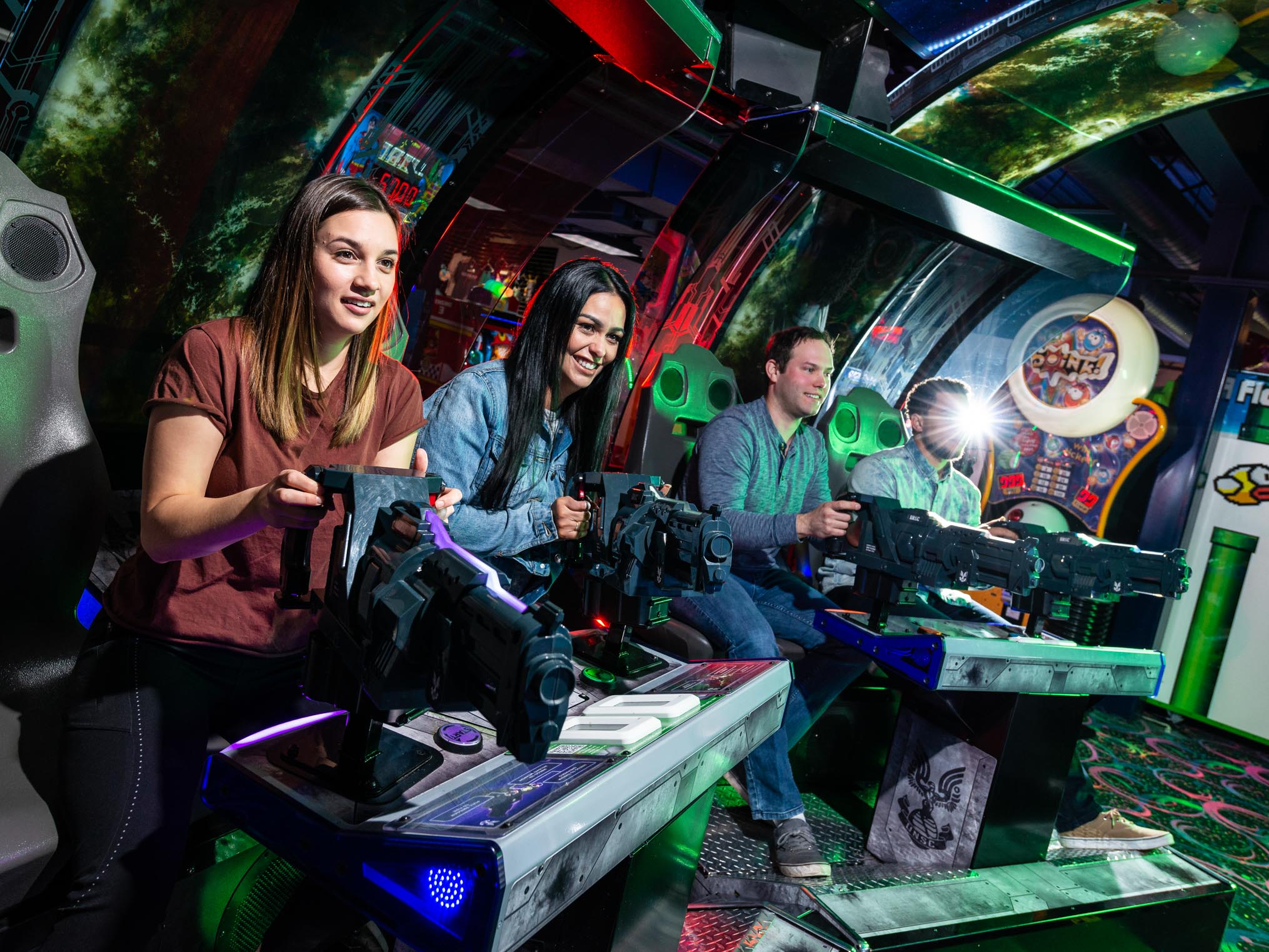 Group of young adults playing a group shooter game