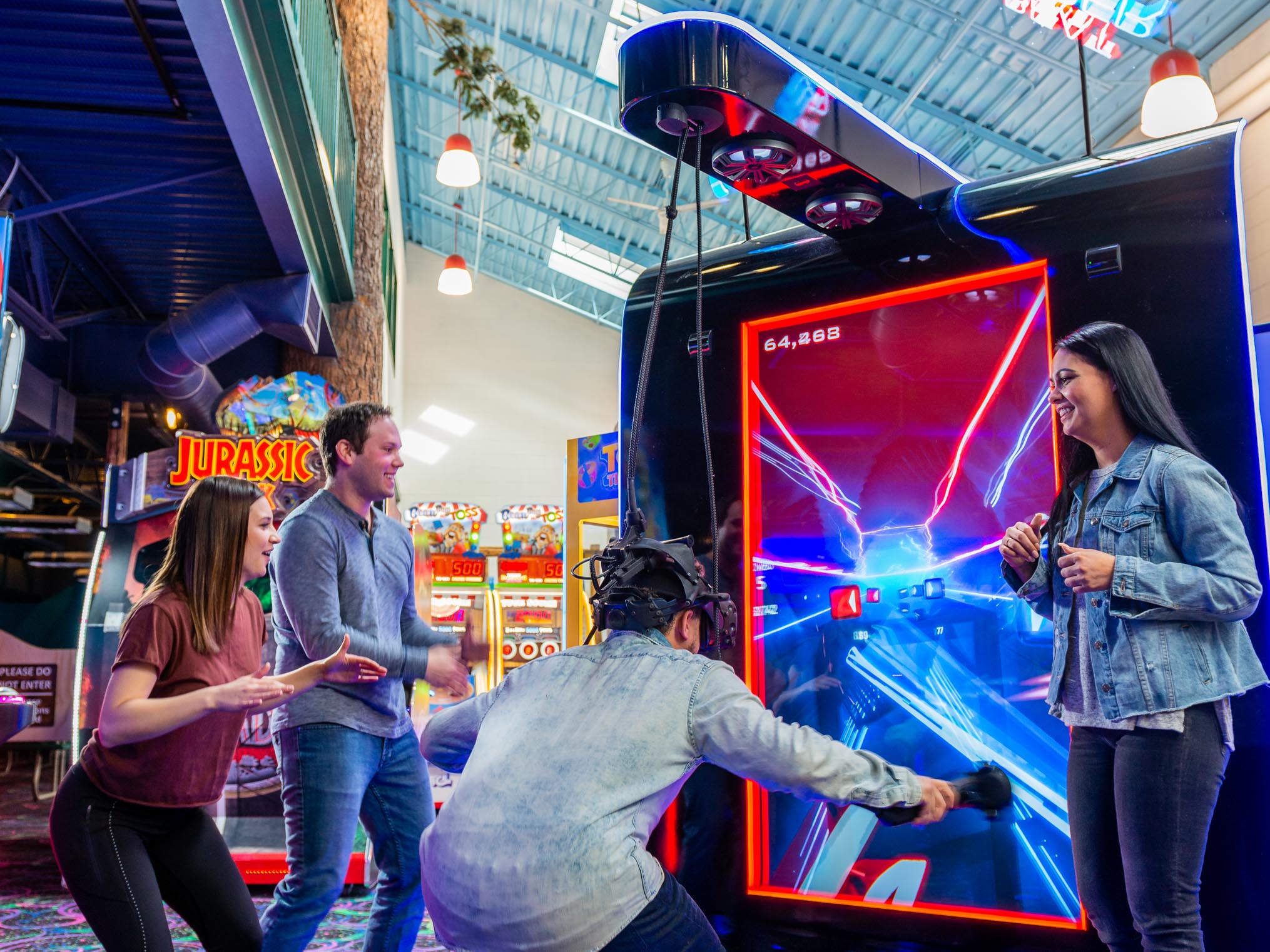 Group of young adults playing beat saber