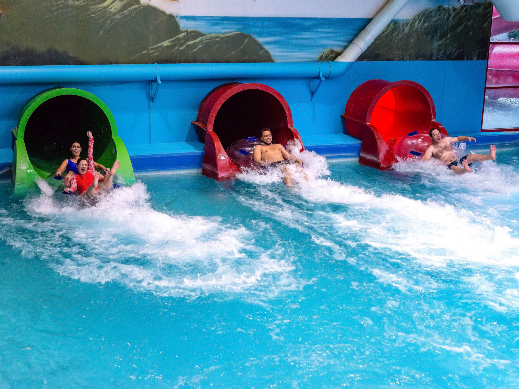 People coming out of all three Lost Falls slides at the same time
