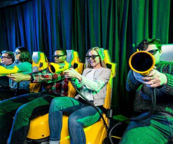 Adults playing on the XD Dark ride
