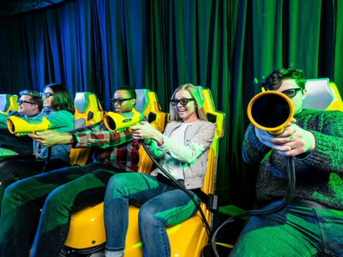 Adults playing on the XD Dark ride