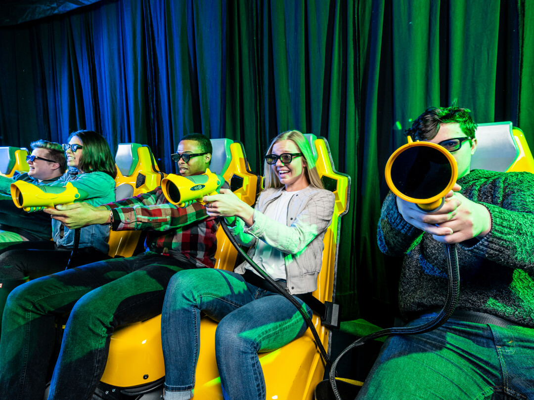 Adults playing on the XD Dark ride