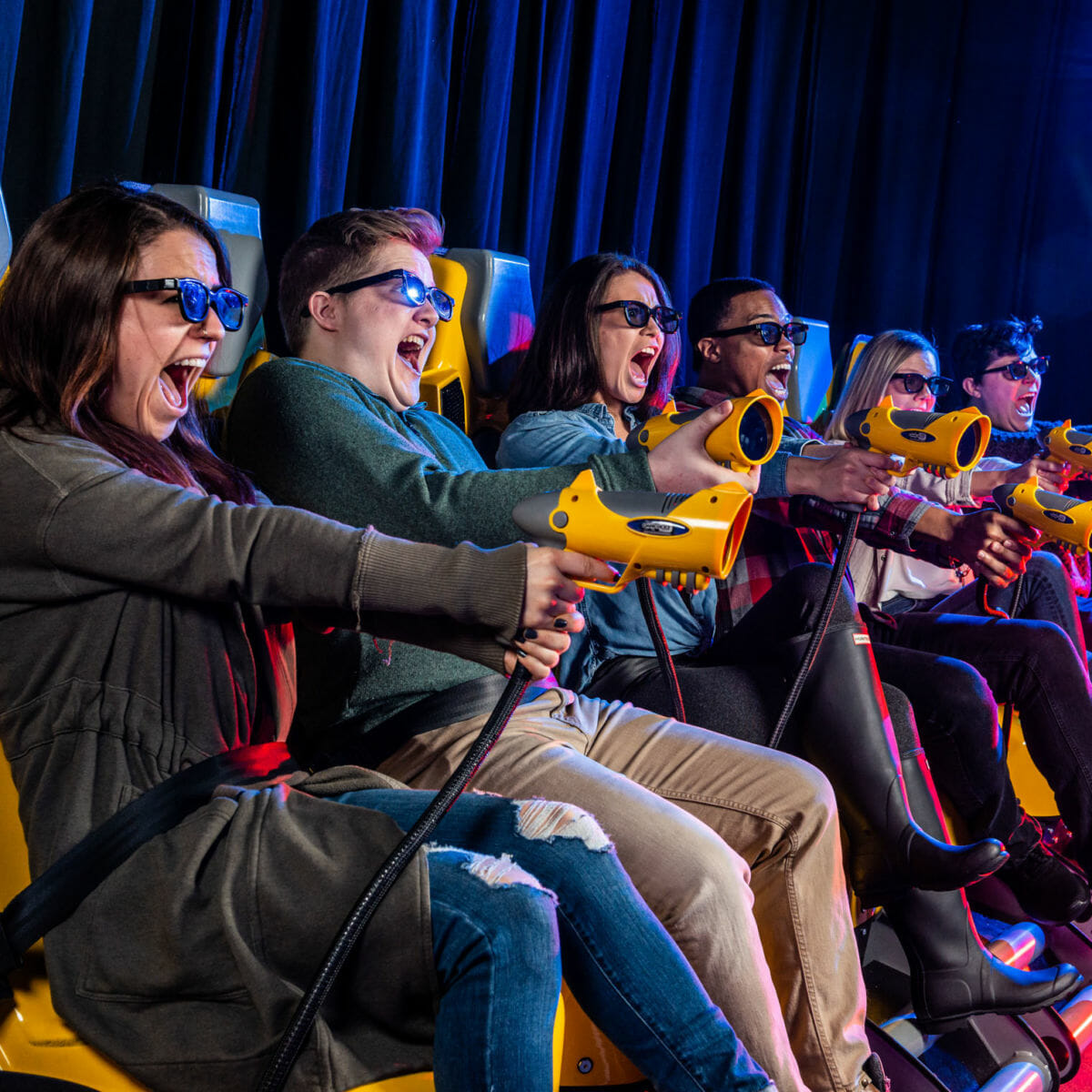 Group of young adults on the XD Dark Ride