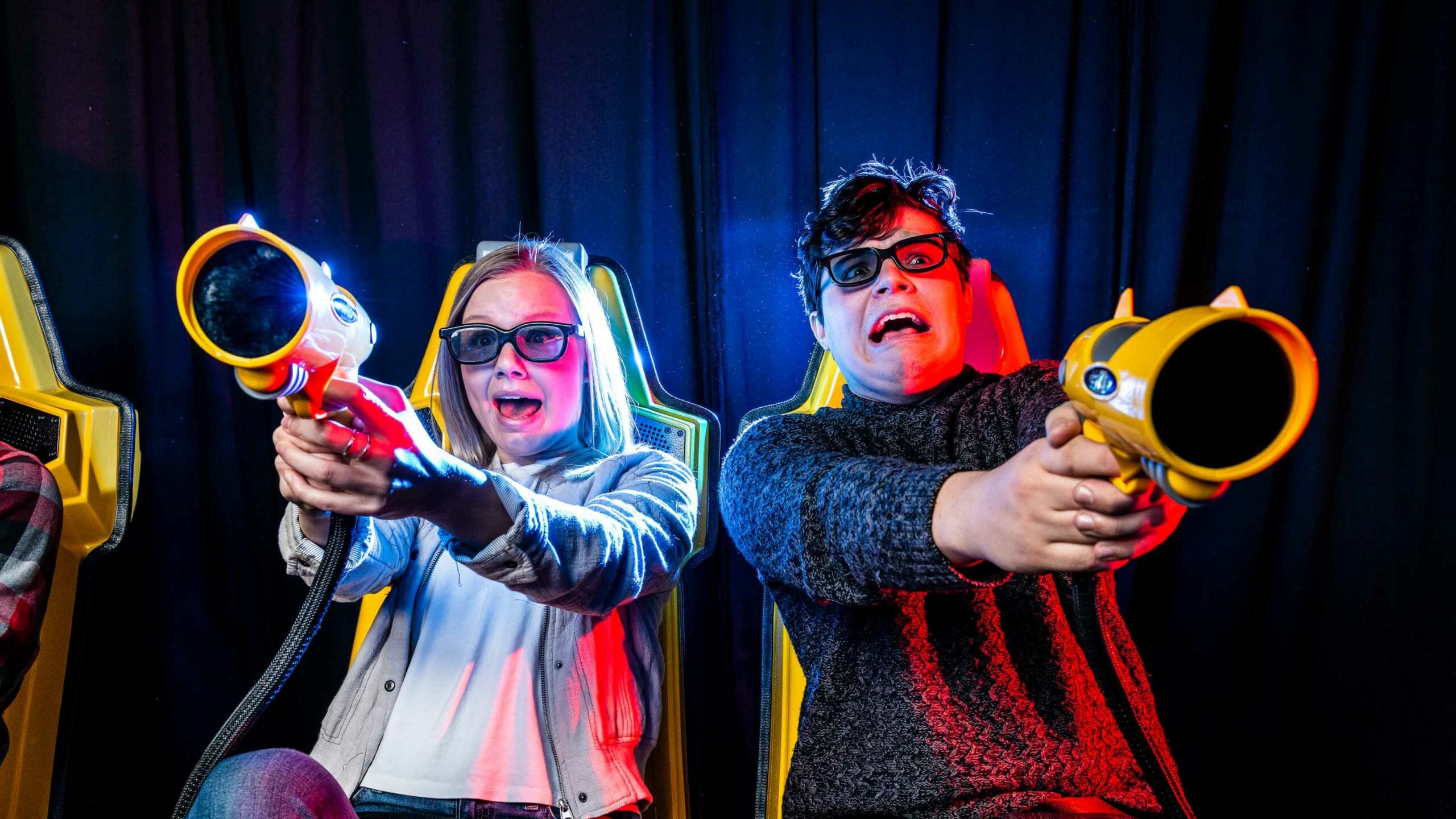 Close up of two people shooting on the XD Dark Ride