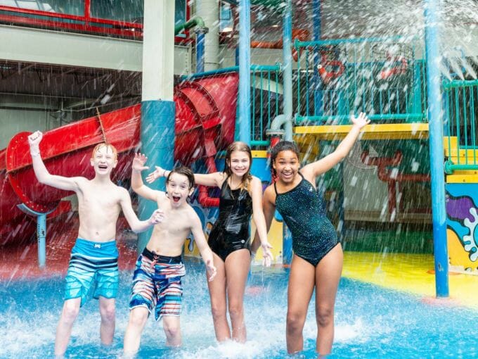 Four young friends in the aquaplay area
