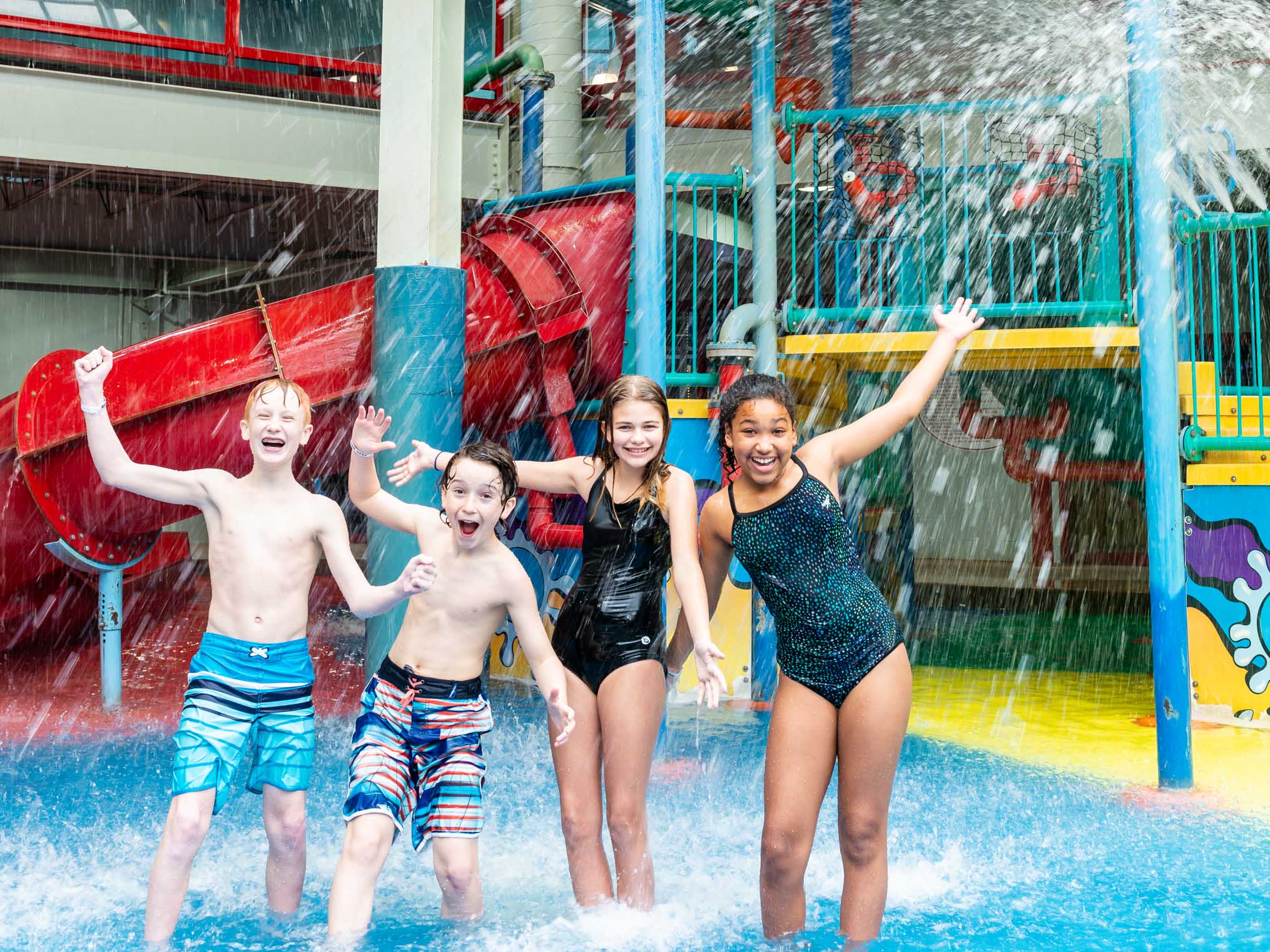 Four young friends in the aquaplay area