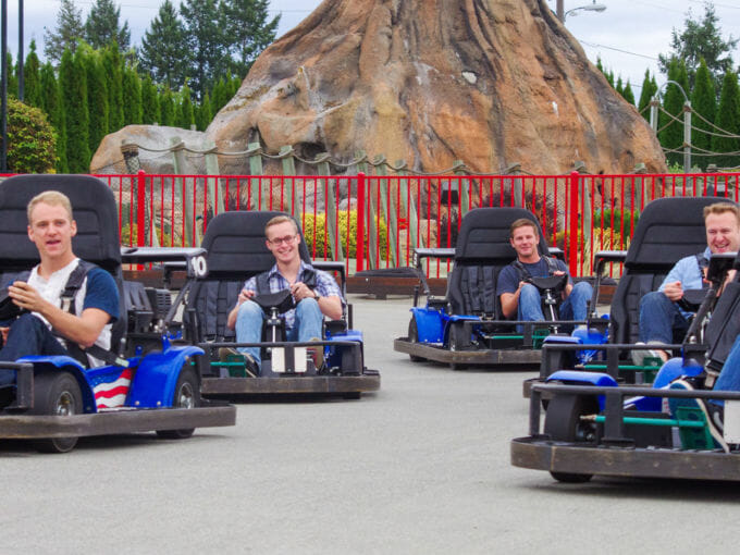 Group of young professionals racing on the Go Kart track