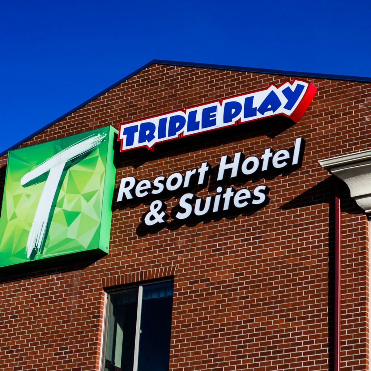 Triple Play Resort Hotel closeup of logo on the building