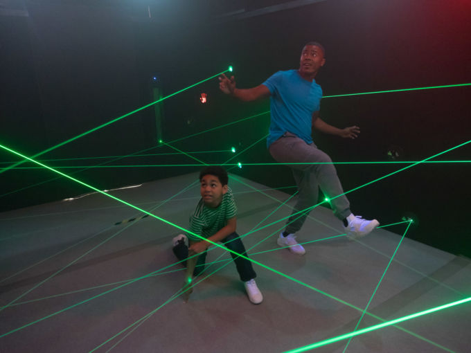 Father and son navigating the laser maze