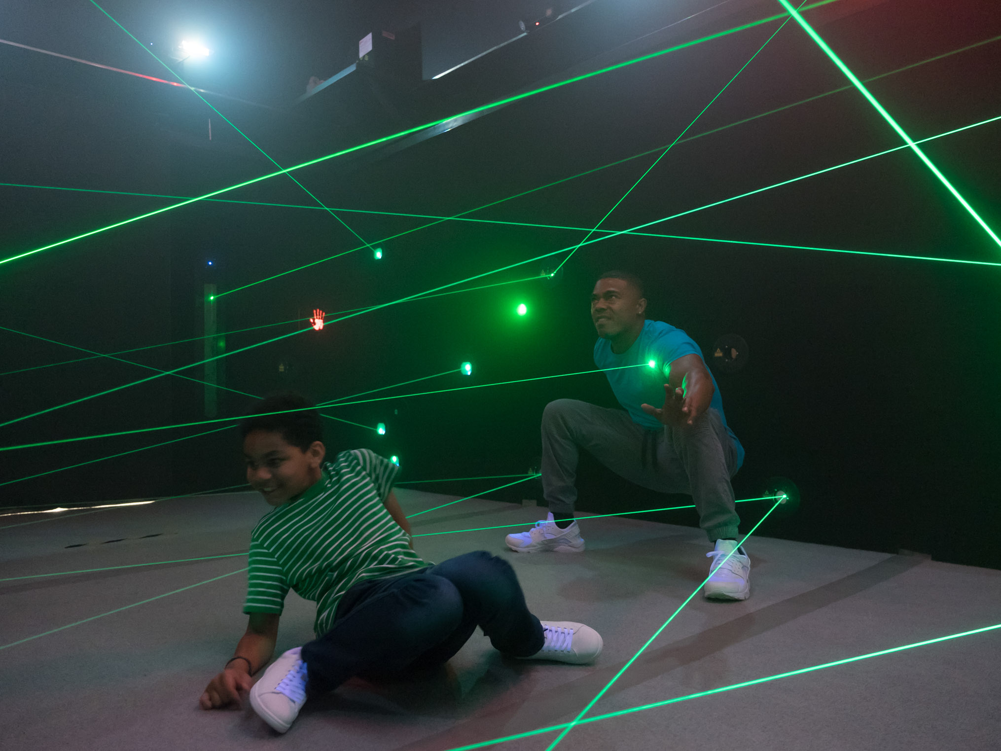 Father and son navigating the laser maze