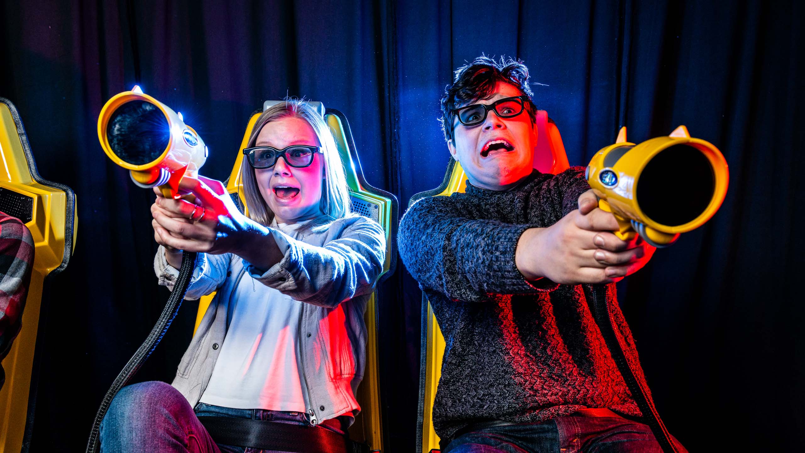 Close up of two people shooting on the XD Dark Ride