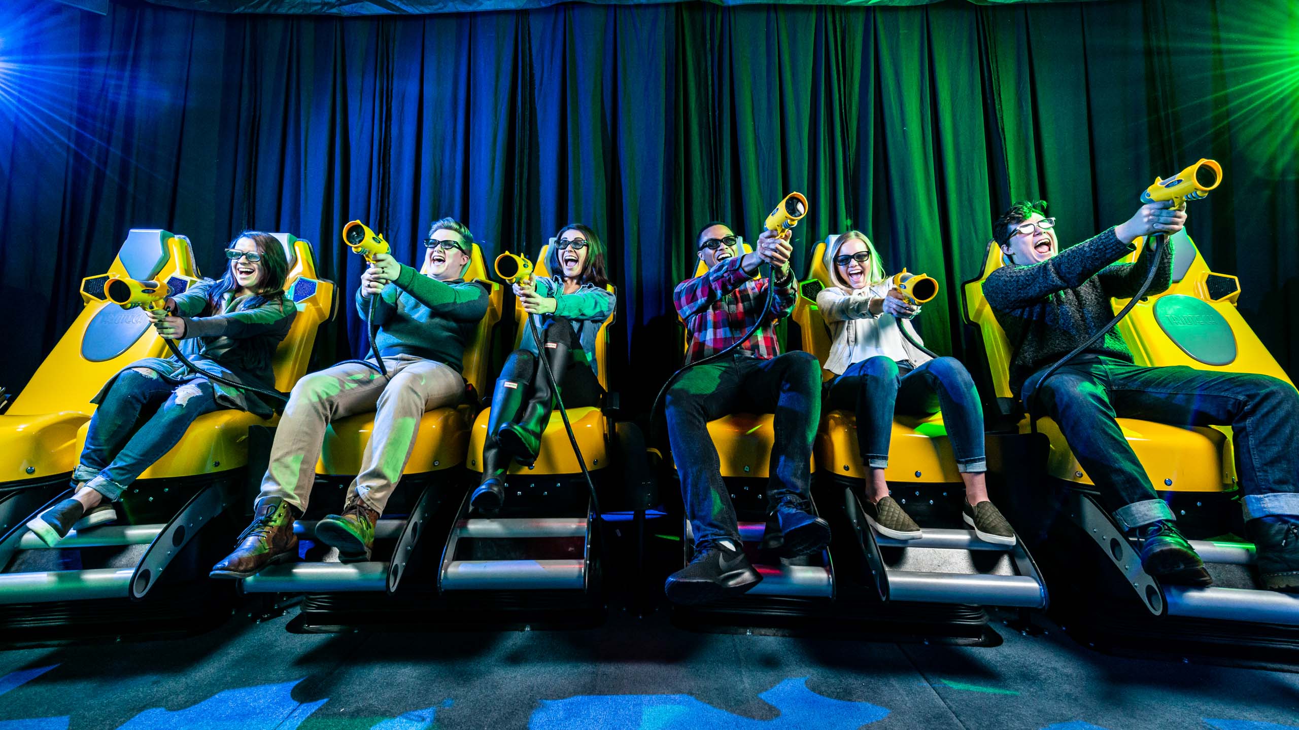 Group of adults on the XD Dark Ride